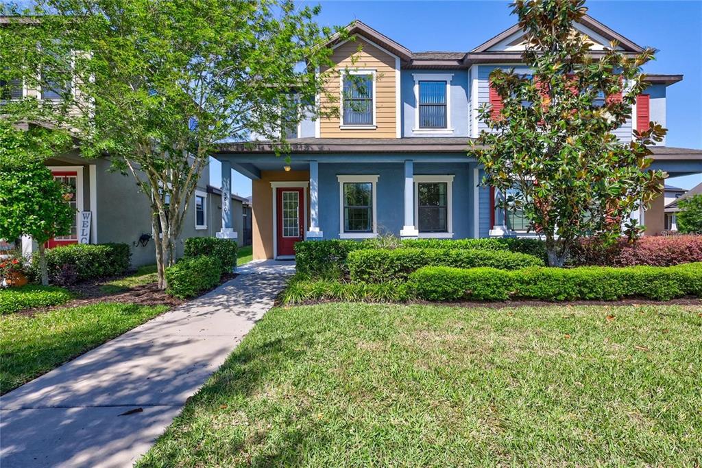 5830 Circa Fishhawk Boulevard Lithia, FL 33547 - Photo 1 of 37 a front view of a house with a garden