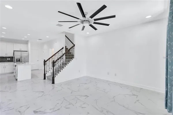 a view of an entryway with wooden floor