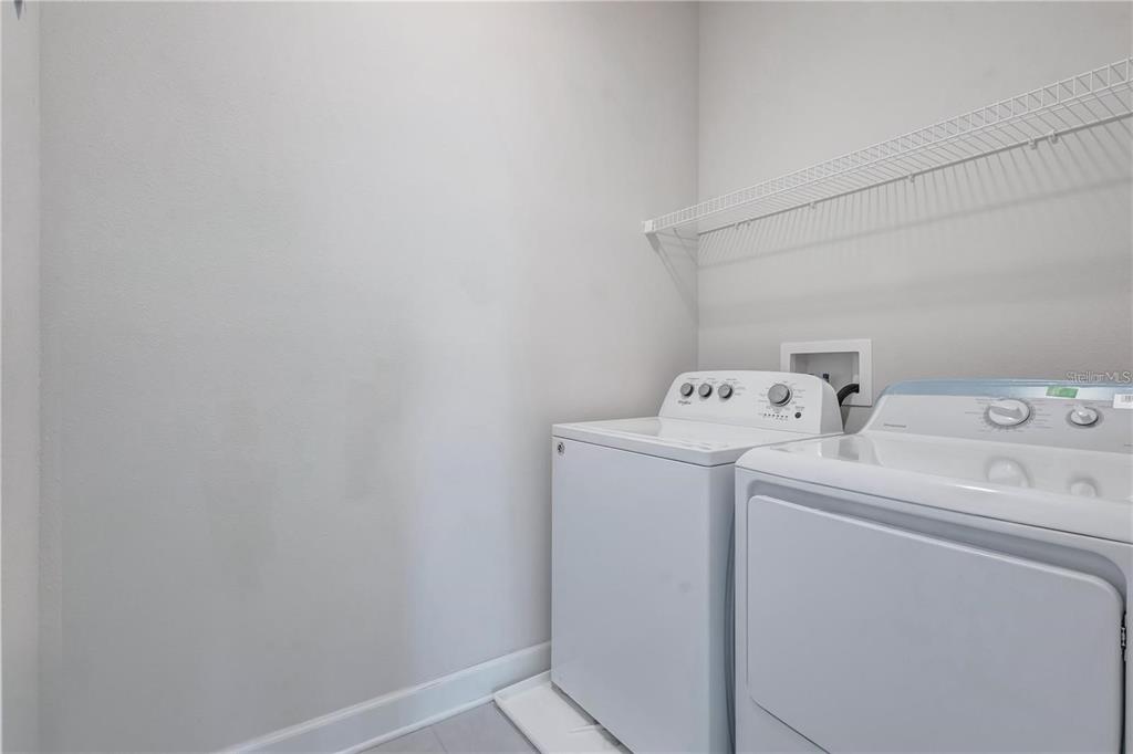 5830 Circa Fishhawk Boulevard Lithia, FL 33547 - Photo 23 of 37 a utility room with dryer and washer