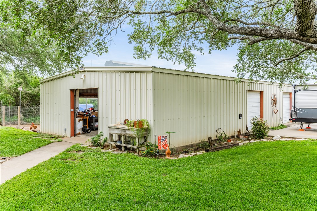 345 Trail Ridge Drive Sandia, TX 78383 - Photo 4 of 40 a backyard of a house with table and chairs