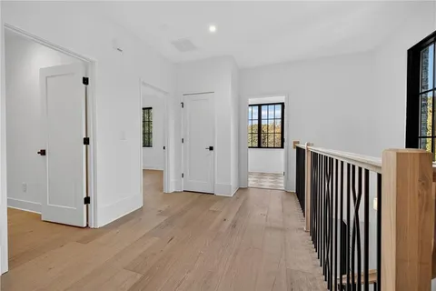 a bathroom with a toilet a sink and glass door