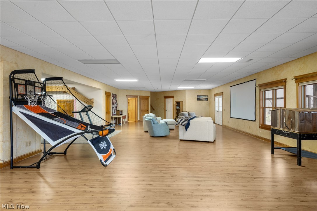 9419 Robinson Road Chardon, OH 44024 - Photo 29 of 46 Recreation room featuring light wood-style flooring and baseboards