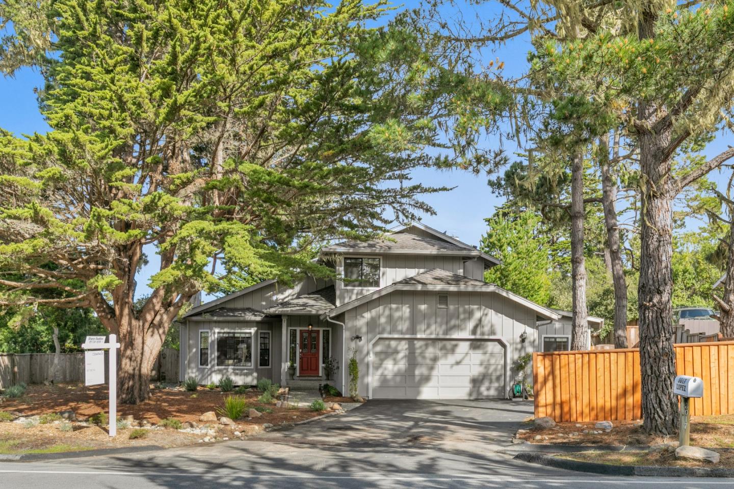 3017 Lopez Road Pebble Beach, CA 93953 - Photo 1 of 30 a front view of a house with a yard