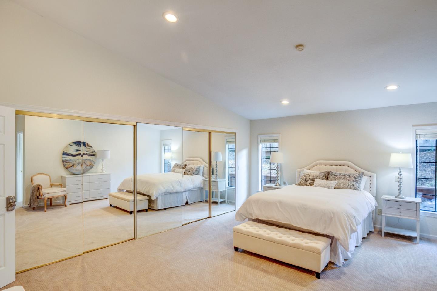 3017 Lopez Road Pebble Beach, CA 93953 - Photo 13 of 30 a spacious bedroom with a bed and a couch