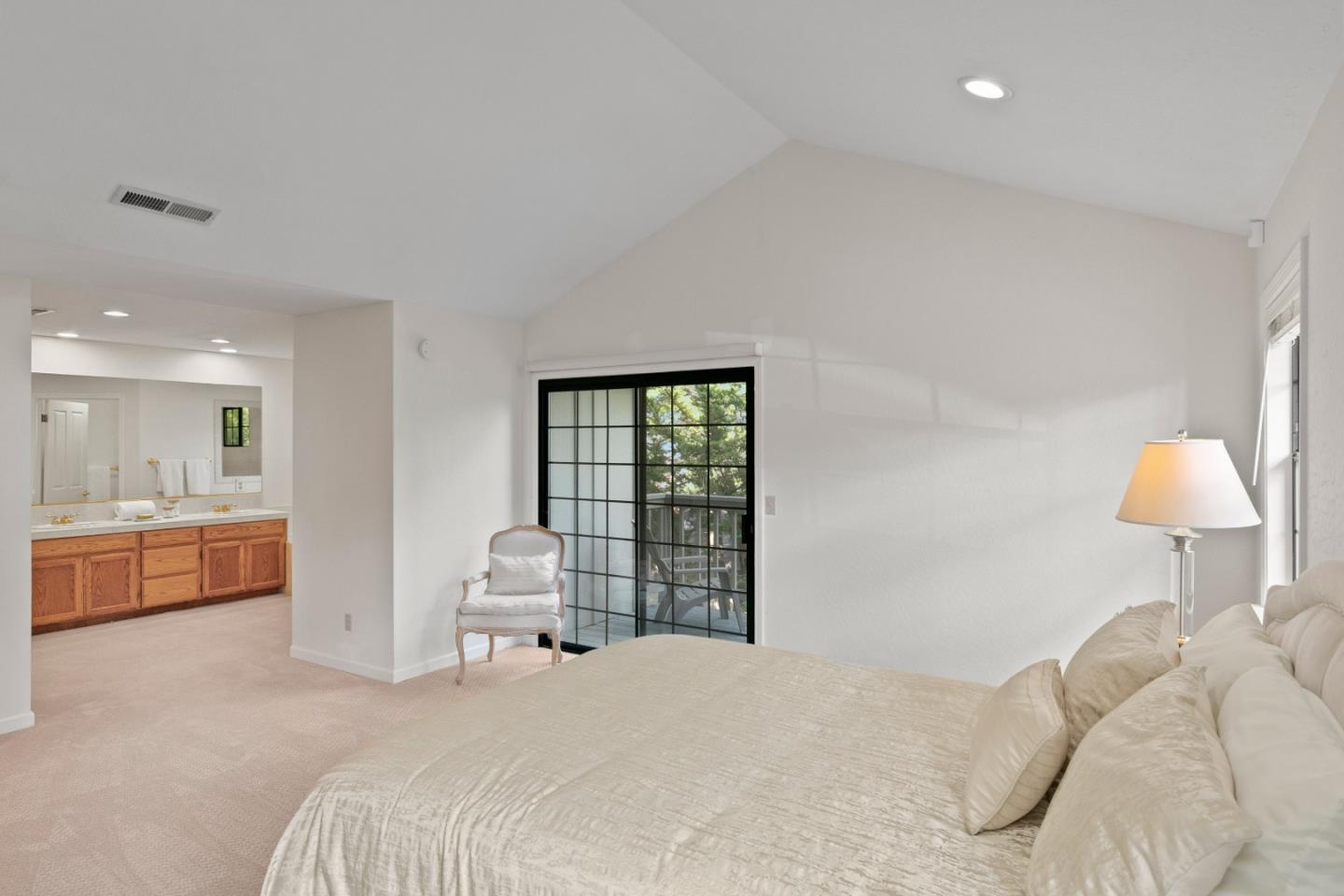 3017 Lopez Road Pebble Beach, CA 93953 - Photo 17 of 30 a bedroom with a bed and a chair