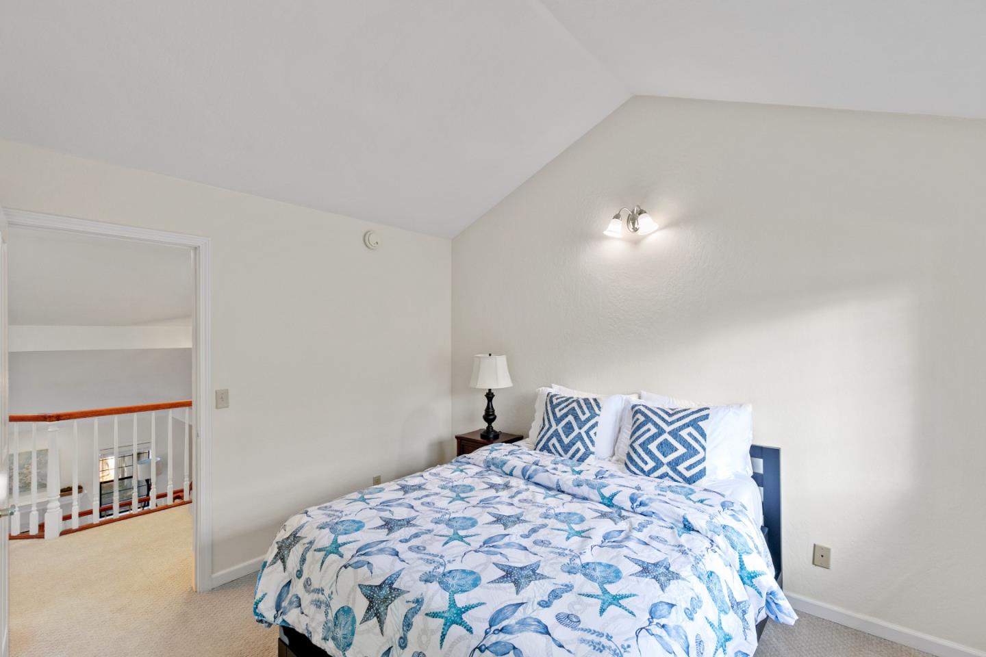 3017 Lopez Road Pebble Beach, CA 93953 - Photo 20 of 30 a bedroom with a large bed and a lamp on dresser