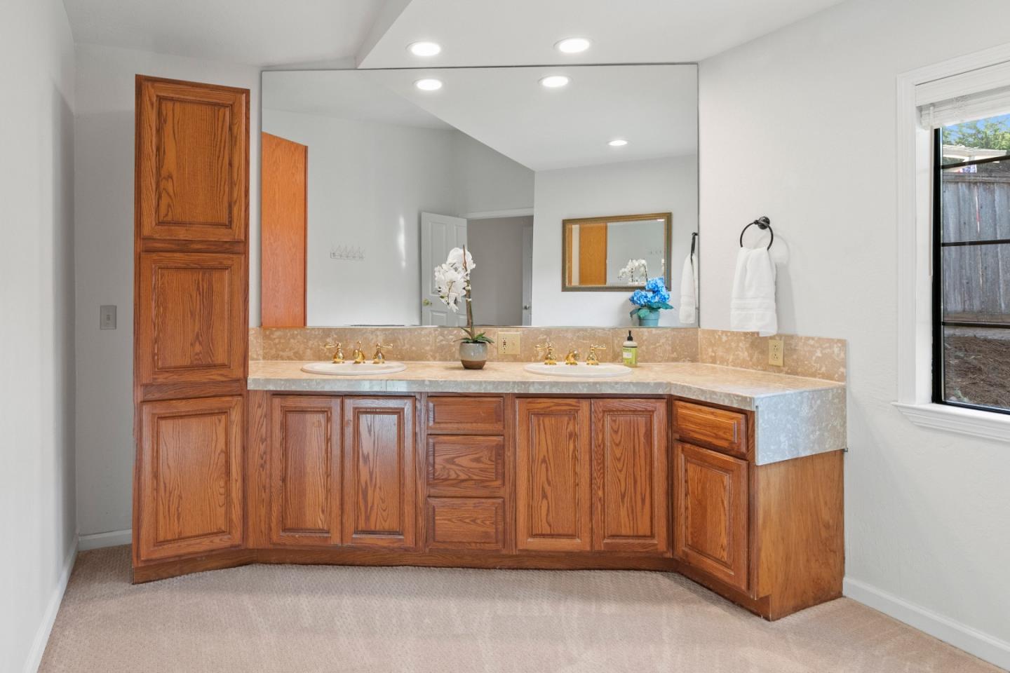 3017 Lopez Road Pebble Beach, CA 93953 - Photo 22 of 30 a bathroom with a sink and a mirror