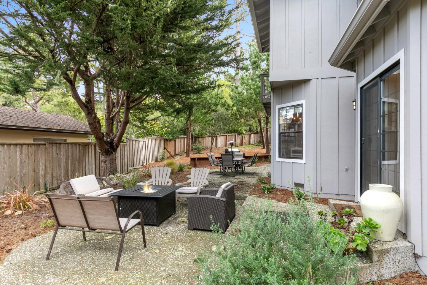 3017 Lopez Road Pebble Beach, CA 93953 - Photo 26 of 30 a backyard of a house with outdoor seating
