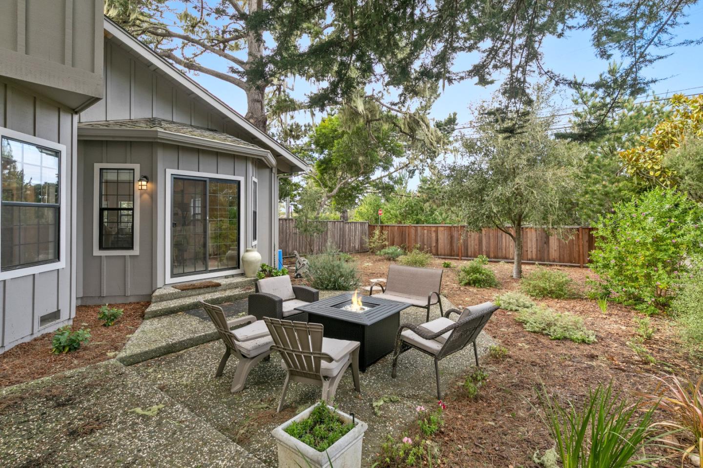 3017 Lopez Road Pebble Beach, CA 93953 - Photo 27 of 30 a backyard of a house with outdoor seating