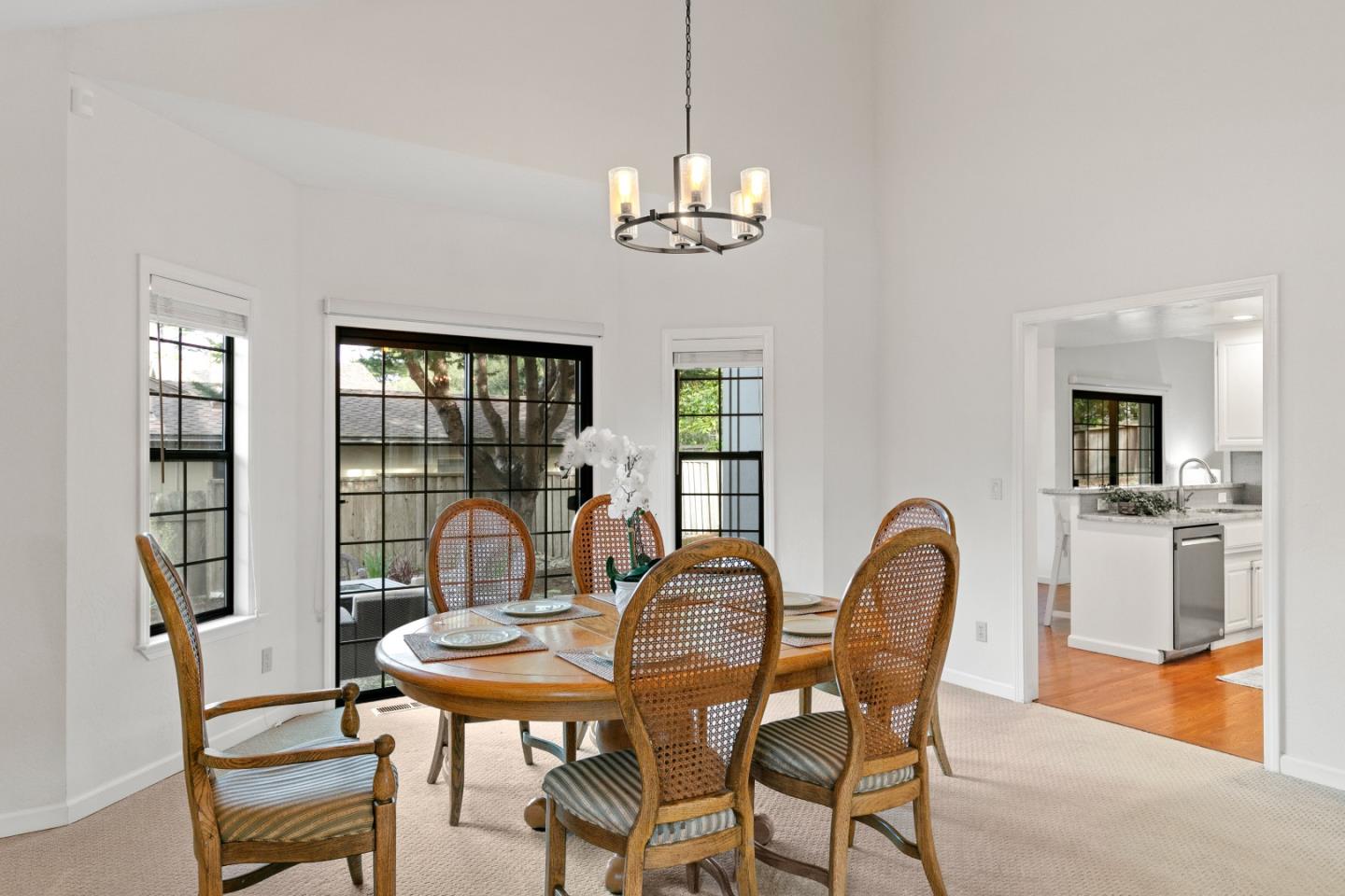 3017 Lopez Road Pebble Beach, CA 93953 - Photo 6 of 30 a dining room with furniture a chandelier and wooden floor