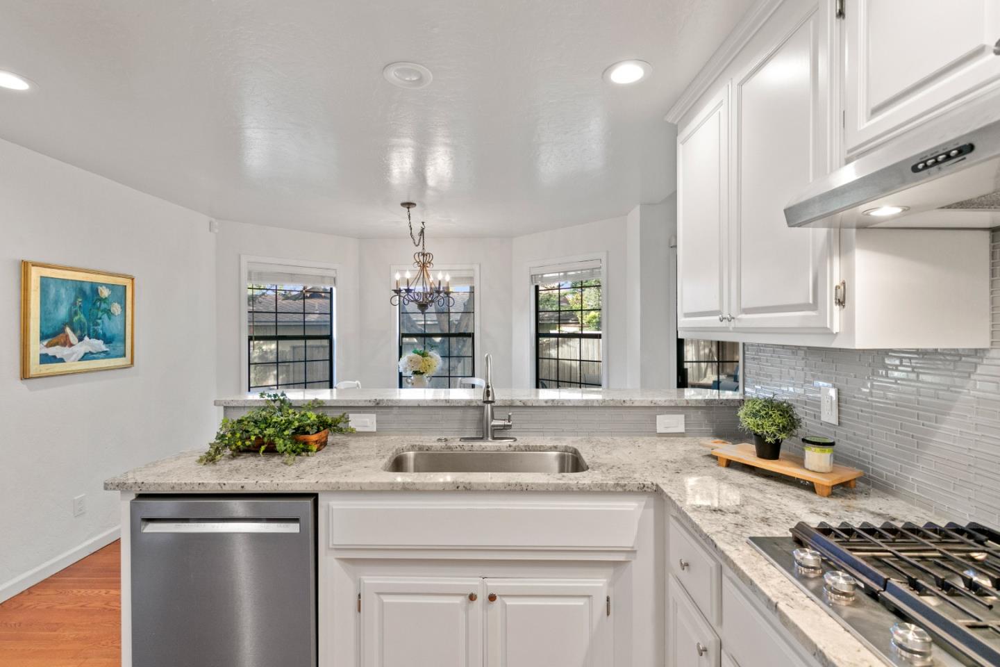 3017 Lopez Road Pebble Beach, CA 93953 - Photo 8 of 30 a kitchen with stainless steel appliances granite countertop a sink stove and cabinets