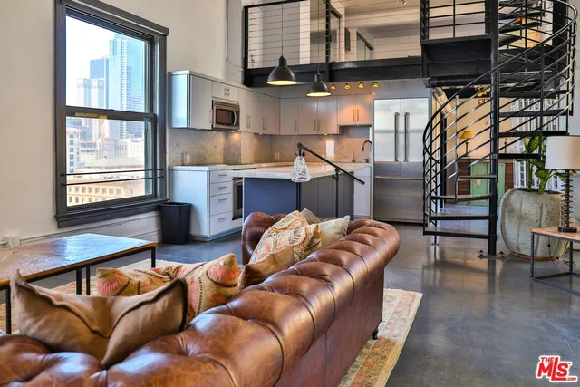 a view of living room kitchen and dining room