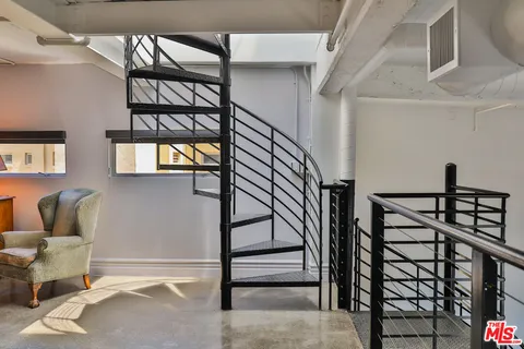 a view of staircase with a rug