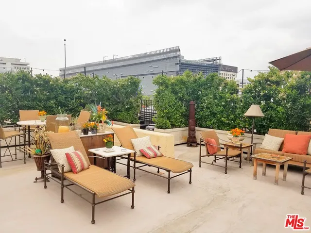 a group of chairs sitting in patio with a table and chairs