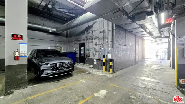 a view of parking garage with cars