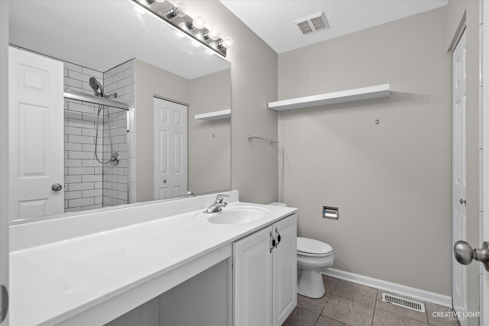 2467 Golf Ridge Circle, Unit 2467 Naperville, IL 60563 - Photo 14 of 25 a bathroom with a sink a toilet and shower
