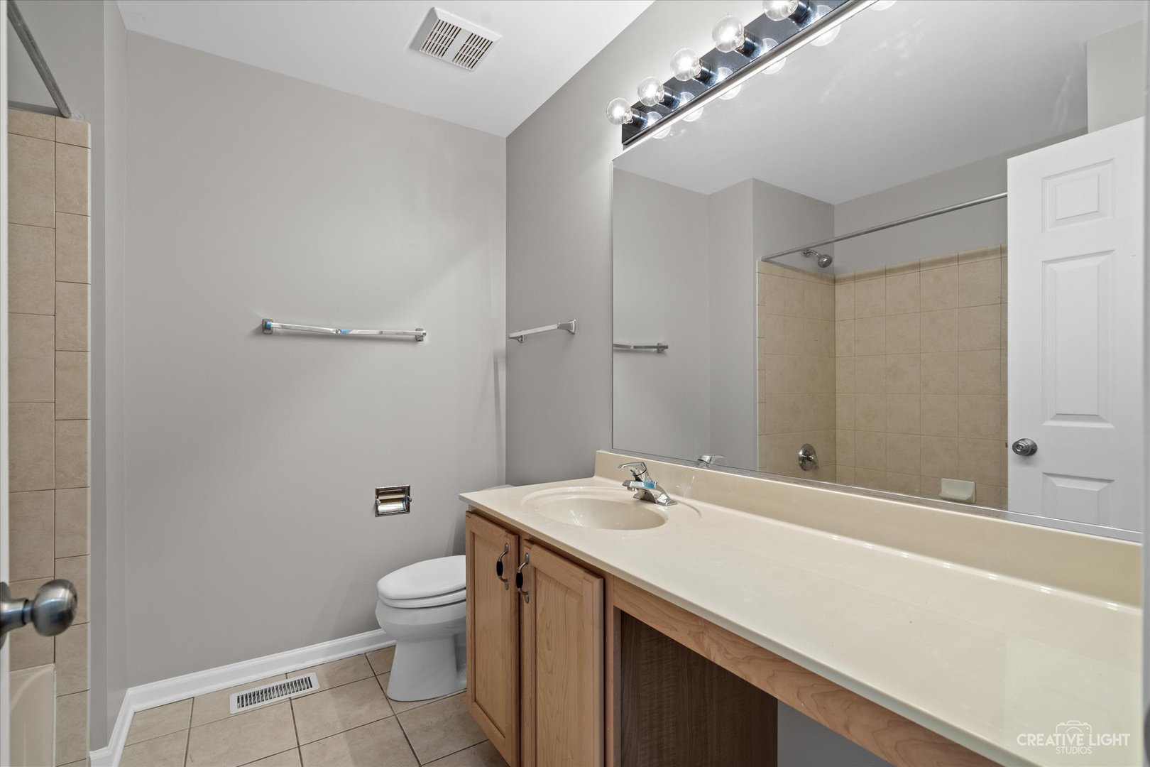 2467 Golf Ridge Circle, Unit 2467 Naperville, IL 60563 - Photo 16 of 25 a bathroom with a sink a toilet and shower