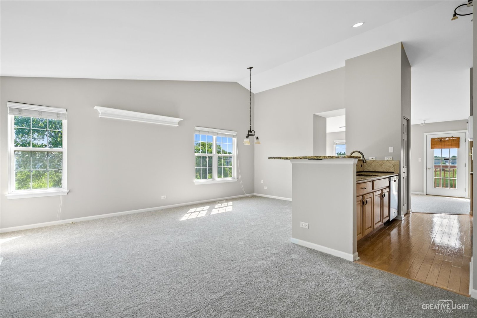 2467 Golf Ridge Circle, Unit 2467 Naperville, IL 60563 - Photo 4 of 25 an empty room with windows and refrigerator