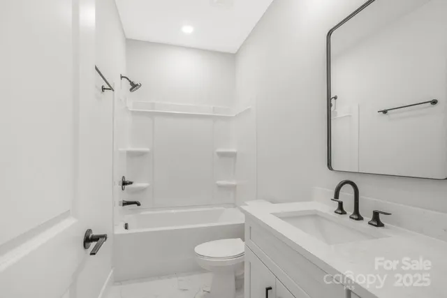 a bathroom with a sink a toilet and a bathtub