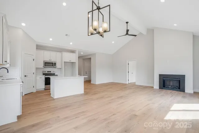 a view of kitchen with cabinets and wooden floor