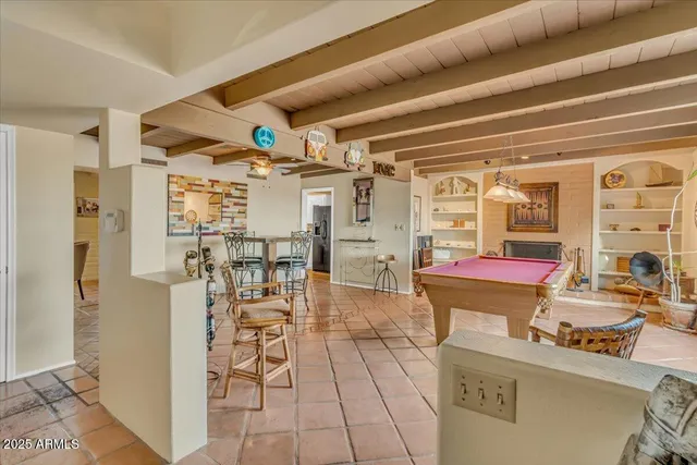 a kitchen with stainless steel appliances granite countertop a sink a stove and cabinets