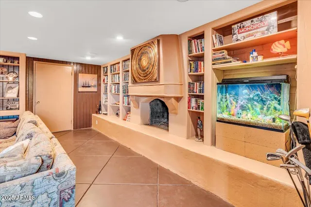 a dining room with furniture and chandelier