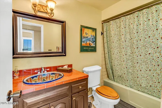 an aerial view of a house with a swimming pool