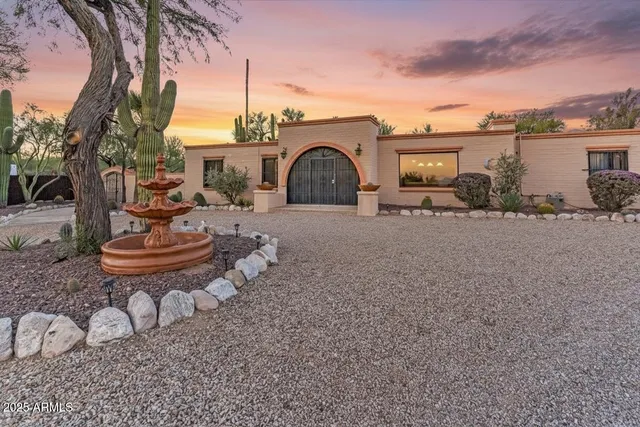 a view of a backyard with sitting area