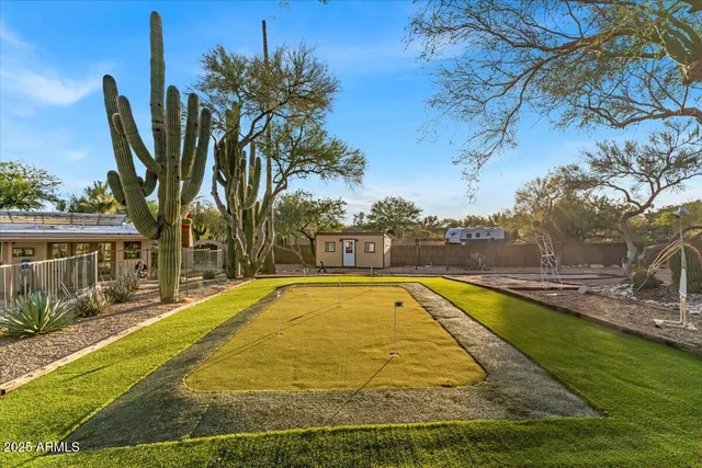 a view of swimming pool with an outdoor space and seating area