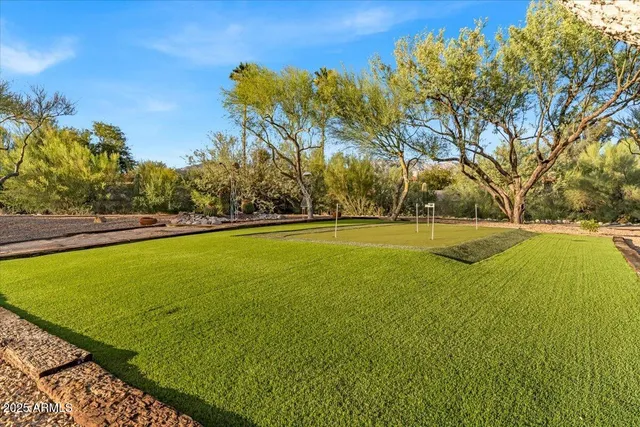 a view of a brick house with a door and a chair
