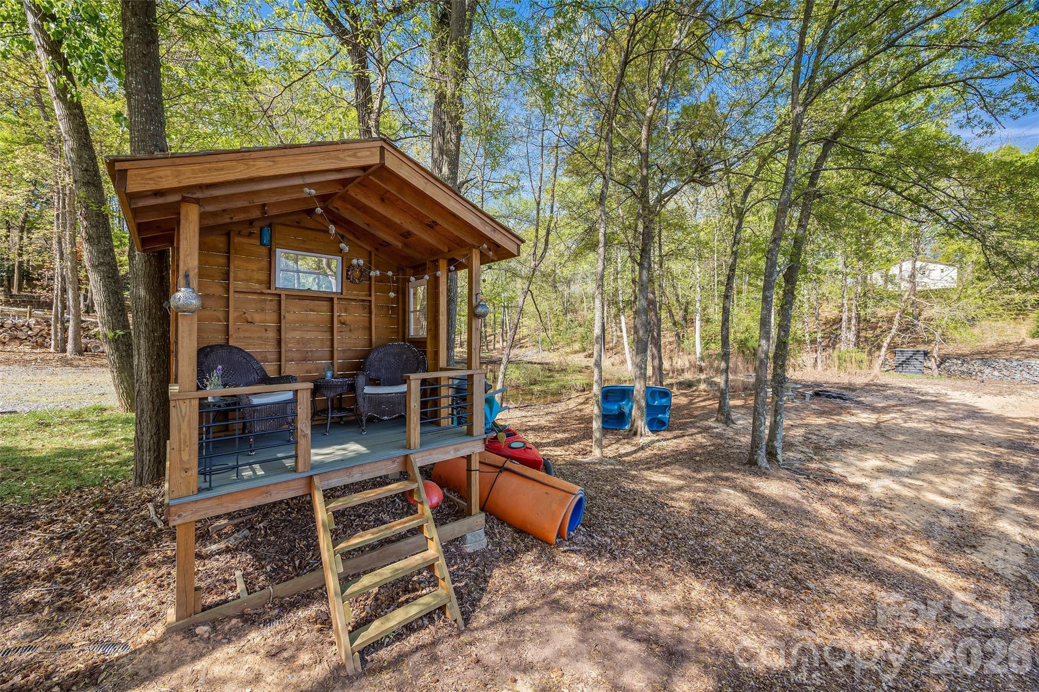 5280 Masons Ferry Road Clover, SC 29710 - Photo 41 of 45 a backyard of a house with barbeque oven table and chairs
