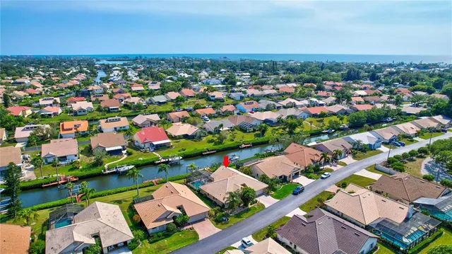 a living room with furniture a rug and a window