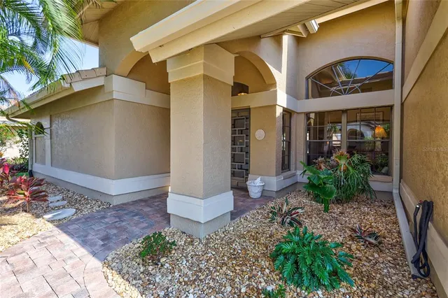 a living room with furniture a ceiling fan and a window