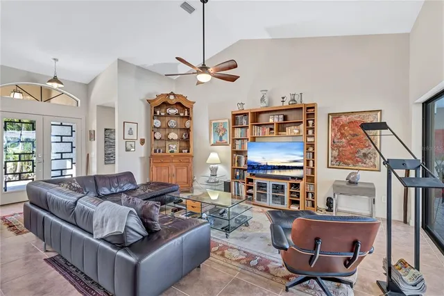 a view of a patio with a table and chairs under an umbrella