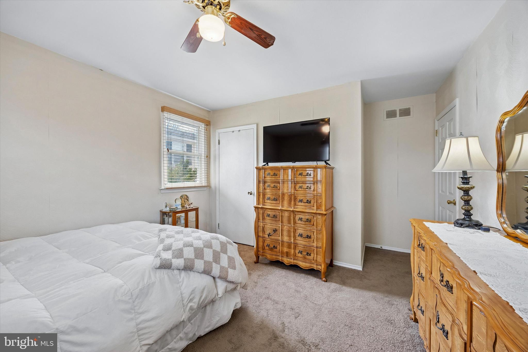 400 Woodhaven Road Philadelphia, PA 19116 - Photo 11 of 25 a bedroom with a bed and a flat screen tv