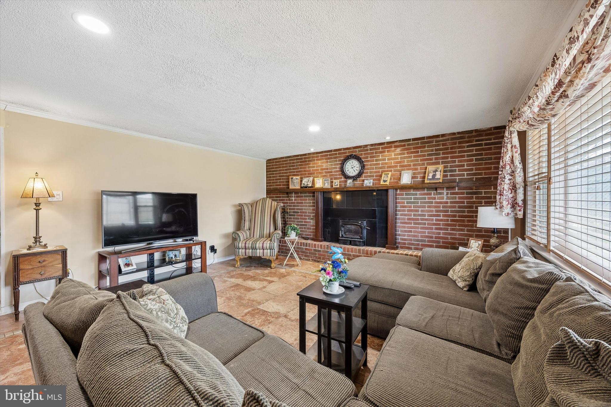 400 Woodhaven Road Philadelphia, PA 19116 - Photo 19 of 25 a living room with furniture and a flat screen tv