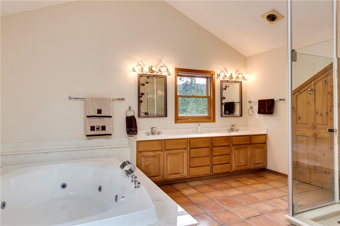 223 Range Road Breckenridge, CO 80424 - Photo 16 of 25 Enormous master bath with over sized jetted tub and walk in shower.