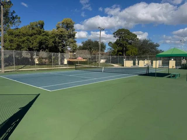 a view of an outdoor space and basketball court