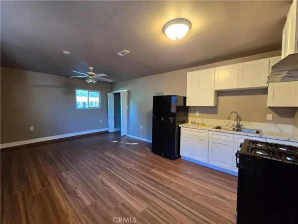 a kitchen with refrigerator and window