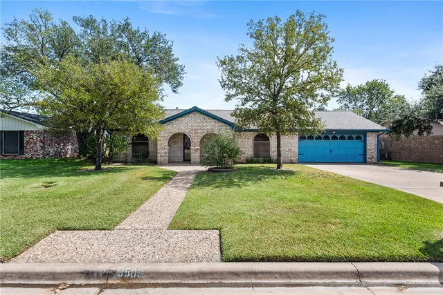 a house view with a garden space