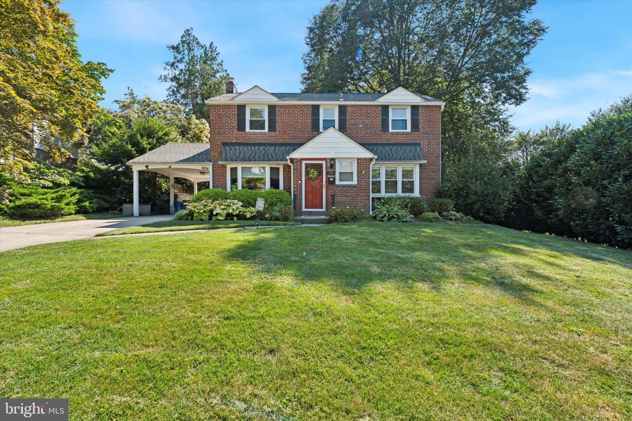 1636 Rose Glen Road Havertown, PA 19083 - Photo 1 of 38 a front view of a house with garden