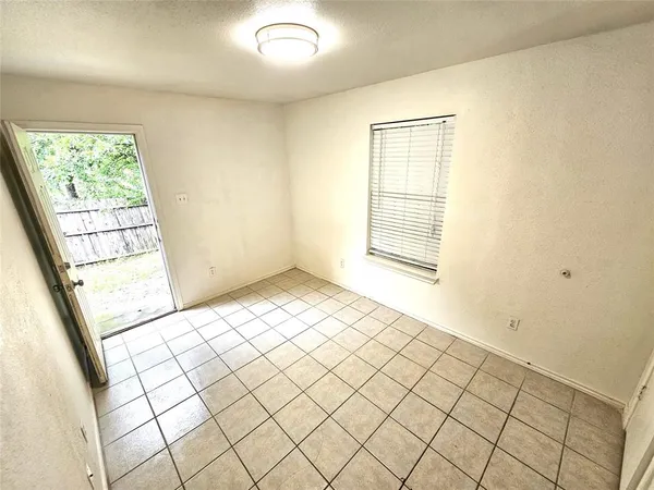 a view of an empty room and window
