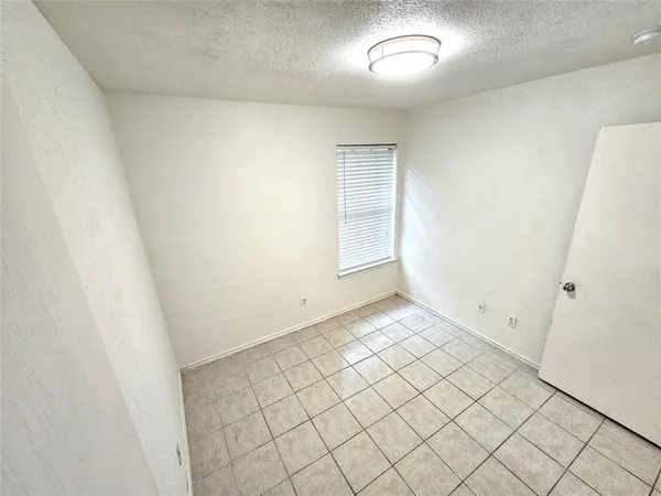 an empty room with white door