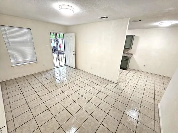 a view of an empty room and window