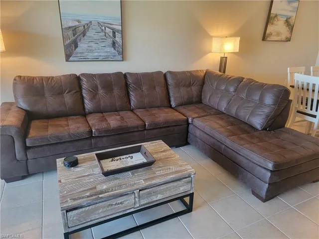 a living room with furniture and a couch