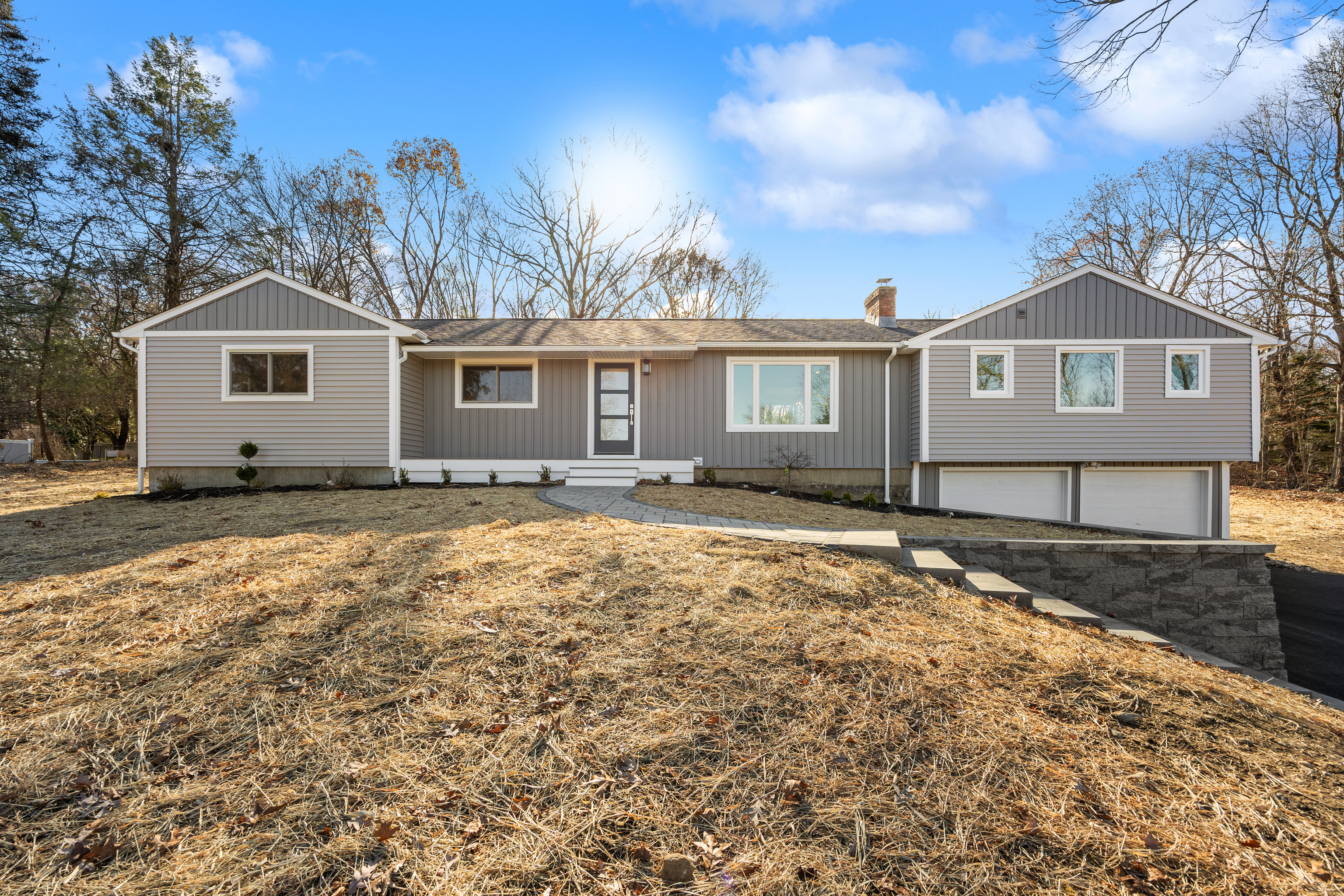 a front view of a house with a yard