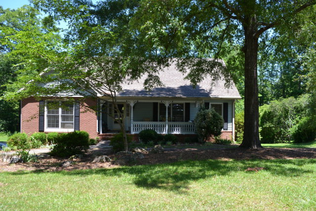 230 Castlegate Road Macon, GA 31210 - Photo 1 of 3 a front view of a house with a yard