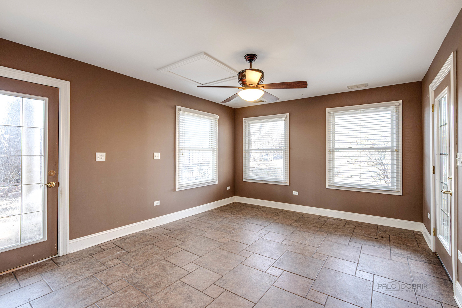 511 Alexander Boulevard Elmhurst, IL 60126 - Photo 14 of 38 an empty room with windows and chandelier fan