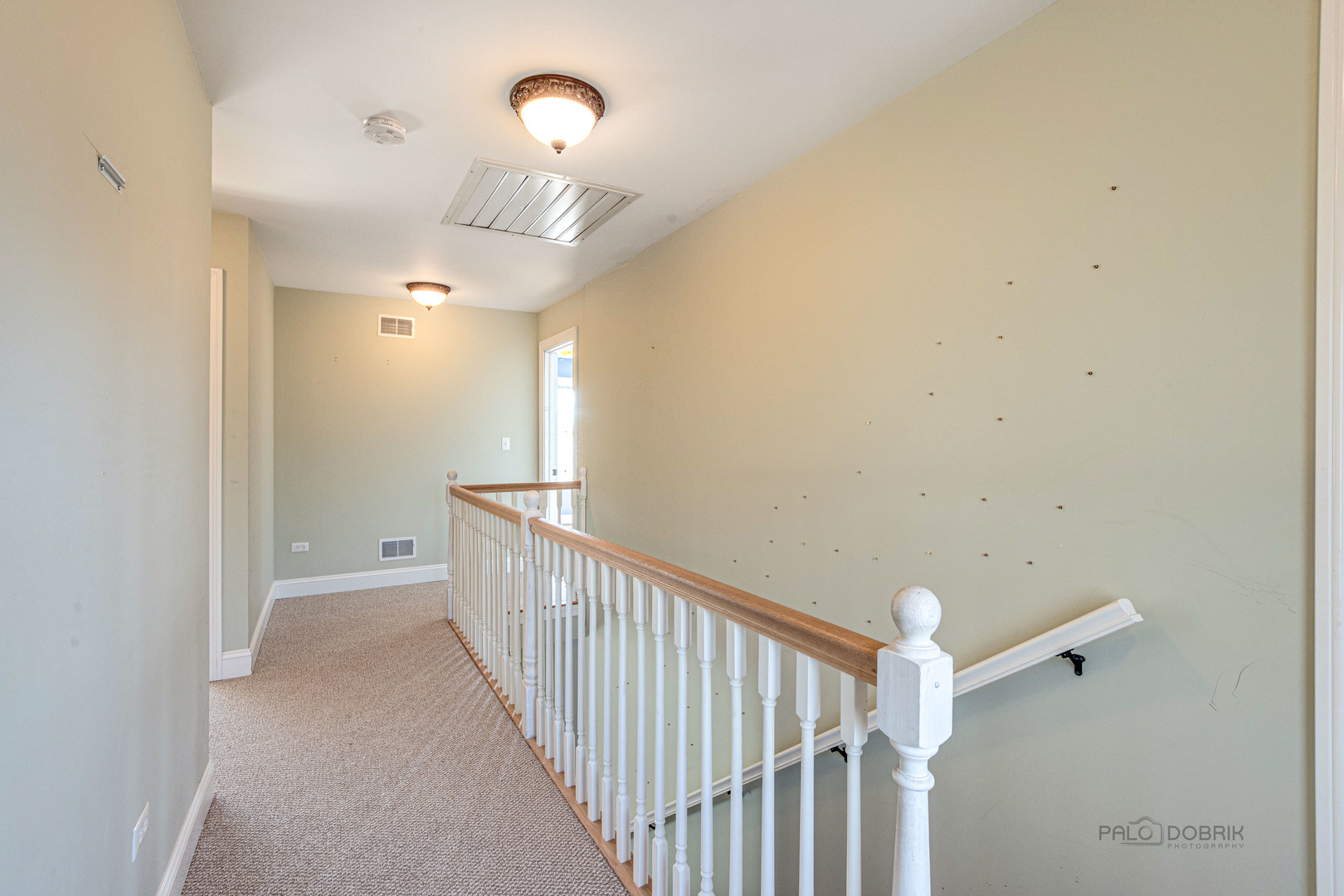 511 Alexander Boulevard Elmhurst, IL 60126 - Photo 17 of 38 a view of a hallway with a chandelier