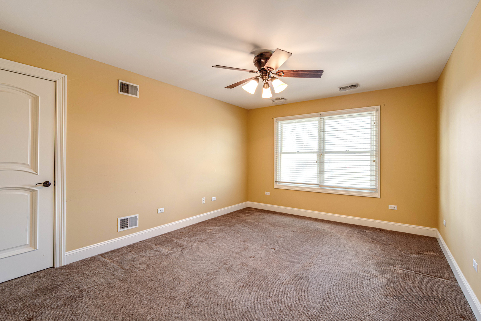 511 Alexander Boulevard Elmhurst, IL 60126 - Photo 19 of 38 a view of room with window and ceiling fan